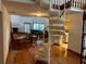 Bright living room with hardwood floors, fireplace, and sliding glass doors leading to a patio at 10 Woodridge Cir, Oldsmar, FL 34677