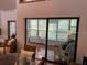 Sunroom with large windows, comfortable seating, and bright, airy feel at 10 Woodridge Cir, Oldsmar, FL 34677