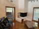 Living room boasts a fireplace and hardwood floors at 10 Woodridge Cir, Oldsmar, FL 34677