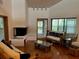 Spacious living room with hardwood floors and a fireplace at 10 Woodridge Cir, Oldsmar, FL 34677