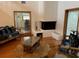 Bright living room with hardwood floors and a fireplace at 10 Woodridge Cir, Oldsmar, FL 34677