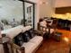 Inviting living room with stylish furniture and a view into dining room at 10 Woodridge Cir, Oldsmar, FL 34677