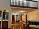 Spacious living area with spiral staircase, hardwood floors, and comfortable seating at 10 Woodridge Cir, Oldsmar, FL 34677