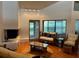 Cozy living room featuring a fireplace, hardwood floors and seating area at 10 Woodridge Cir, Oldsmar, FL 34677