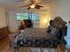 Spacious main bedroom with a king-size bed and access to a balcony at 10 Woodridge Cir, Oldsmar, FL 34677