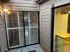 Private patio with sliding glass doors and a door to the kitchen at 10 Woodridge Cir, Oldsmar, FL 34677