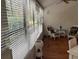 Inviting porch with wicker chairs offering a cozy and serene atmosphere at 10 Woodridge Cir, Oldsmar, FL 34677