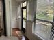 Sunroom with private access to exterior at 10 Woodridge Cir, Oldsmar, FL 34677