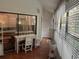 Sunroom with access to private patio and yard at 10 Woodridge Cir, Oldsmar, FL 34677