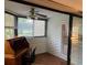 Sunroom with wood desk and view of the backyard at 10 Woodridge Cir, Oldsmar, FL 34677