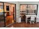 Spacious sunroom with built-in shelving and seating at 10 Woodridge Cir, Oldsmar, FL 34677