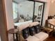 Bright sunroom with wicker furniture and large windows at 10 Woodridge Cir, Oldsmar, FL 34677