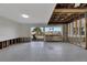 Living room with sliding glass doors and water views, ready for renovation at 1009 Spindle Palm Way, Apollo Beach, FL 33572