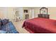 Inviting bedroom with a large bed, ample natural light, and a cozy sitting area at 10114 Lindelaan Dr, Tampa, FL 33618