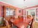 Formal dining area with a large wooden table, chandelier, and built-in hutch at 10114 Lindelaan Dr, Tampa, FL 33618