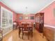 Elegant dining room featuring a chandelier, wooden table, and china cabinet at 10114 Lindelaan Dr, Tampa, FL 33618