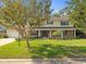 Charming two-story residence with a brick and siding exterior and front yard at 10114 Lindelaan Dr, Tampa, FL 33618