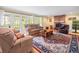 Spacious living area with fireplace, wood floors, and access to backyard at 10114 Lindelaan Dr, Tampa, FL 33618