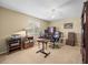 Home office with a desk, chair, printer, ample storage, and natural light at 10114 Lindelaan Dr, Tampa, FL 33618