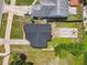 Overhead view of a home with an outdoor living area, fire pit, and landscaped backyard at 102 Shore E Dr, Oldsmar, FL 34677