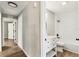 Bathroom features an updated vanity and shower-tub combination at 102 Shore E Dr, Oldsmar, FL 34677