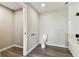 Bathroom featuring wood look floors, a separate water closet, and white trim at 102 Shore E Dr, Oldsmar, FL 34677