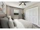 Bedroom featuring a ceiling fan, large closet and comfortable furnishings at 102 Shore E Dr, Oldsmar, FL 34677