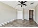 This bedroom features wood-look floors, closet, and adjoining room entrance at 102 Shore E Dr, Oldsmar, FL 34677