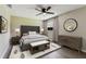 Comfortable bedroom featuring a ceiling fan, rug, and tasteful decor at 102 Shore E Dr, Oldsmar, FL 34677