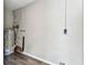 Spacious pantry area with water heater and concrete block walls at 102 Shore E Dr, Oldsmar, FL 34677