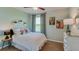 Bright bedroom with a double bed, window, and decorative accents at 11121 40Th E Ave, Palmetto, FL 34221