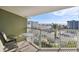 Private balcony with ocean view and outdoor seating at 11605 Gulf Blvd # 502, Treasure Island, FL 33706