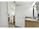 Clean bathroom with granite countertop and light wood cabinets at 11605 Gulf Blvd # 502, Treasure Island, FL 33706
