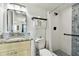 Updated bathroom with walk-in shower, granite vanity, and modern fixtures at 11605 Gulf Blvd # 502, Treasure Island, FL 33706