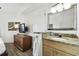 Bathroom with granite countertop, single sink, and large mirror at 11605 Gulf Blvd # 502, Treasure Island, FL 33706