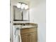 Vanity with granite countertop and a large mirror at 11605 Gulf Blvd # 502, Treasure Island, FL 33706