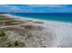 Expansive beach with clear water and blue sky at 11605 Gulf Blvd # 502, Treasure Island, FL 33706