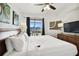 King-size bed, balcony access and flat screen TV at 11605 Gulf Blvd # 502, Treasure Island, FL 33706