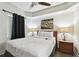 Bright bedroom with ceiling fan and ensuite bathroom at 11605 Gulf Blvd # 502, Treasure Island, FL 33706