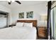 King-size bed, ceiling fan, and closet at 11605 Gulf Blvd # 502, Treasure Island, FL 33706
