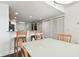 Dining area with kitchen views and breakfast bar at 11605 Gulf Blvd # 502, Treasure Island, FL 33706