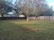 Large backyard with fenced perimeter and mature trees at 1638 Sand Hollow Ln, Valrico, FL 33594