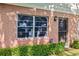 Close-up of the front entrance, showcasing the brick facade and landscaping at 2488 Enterprise Rd # 2, Clearwater, FL 33763