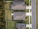 Aerial view of a house and surrounding neighborhood at 30399 Marquette Ave, Wesley Chapel, FL 33545