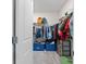 Large walk-in closet with shelving and storage bins at 30399 Marquette Ave, Wesley Chapel, FL 33545