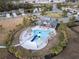 Community pool with a water slide and lounge chairs at 30399 Marquette Ave, Wesley Chapel, FL 33545