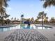 Relaxing community pool with a slide and lounge area at 30399 Marquette Ave, Wesley Chapel, FL 33545