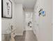 Bright hallway with glass-top table and access to other rooms at 30399 Marquette Ave, Wesley Chapel, FL 33545
