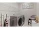 Laundry room with washer, dryer, and shelving at 30399 Marquette Ave, Wesley Chapel, FL 33545