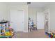 Playroom with built-in shelving and toys at 30399 Marquette Ave, Wesley Chapel, FL 33545